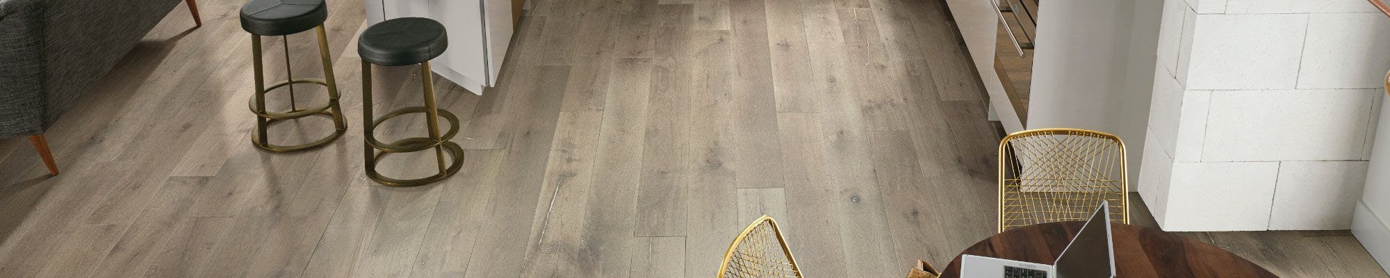 Kitchen dining area with hardwood flooring from Brennan's Carpet in Hailey, ID